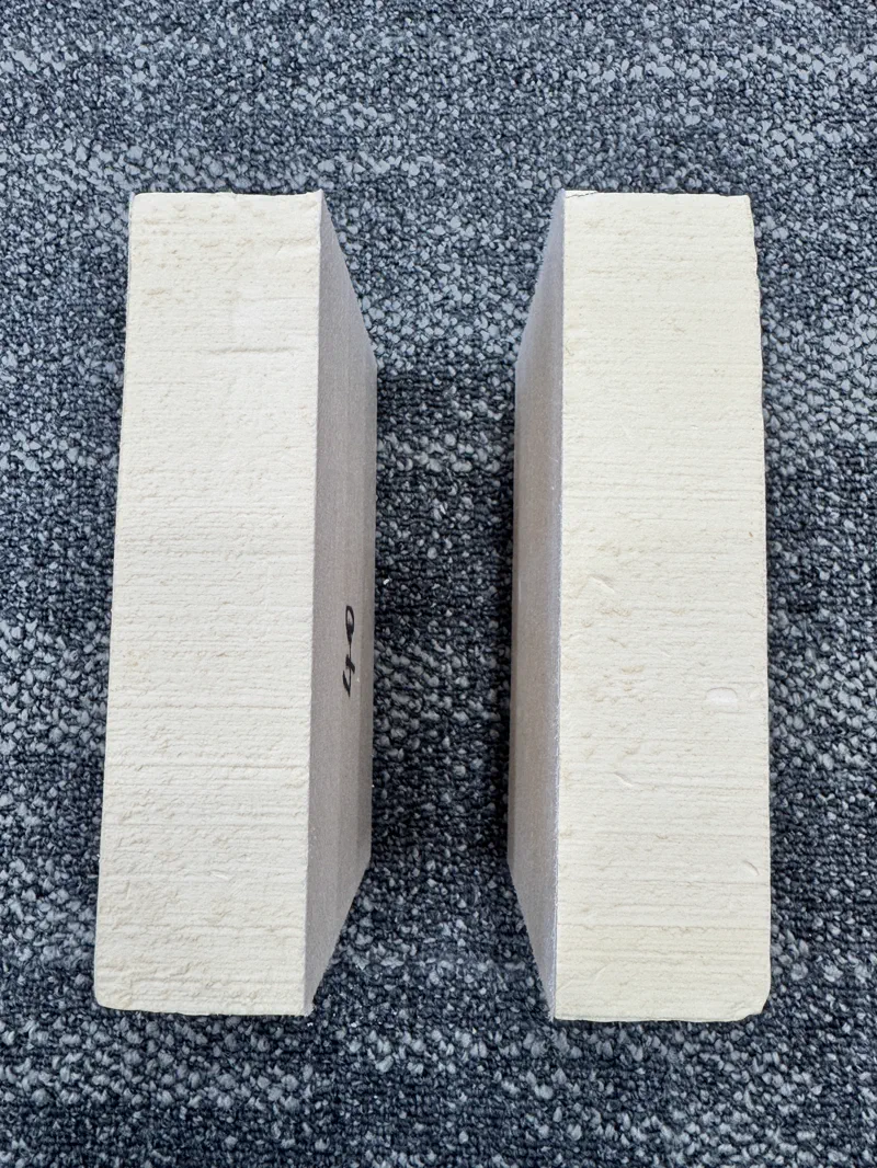 PU sandwich panel — stacked finished panels ready for shipping, factory floor view