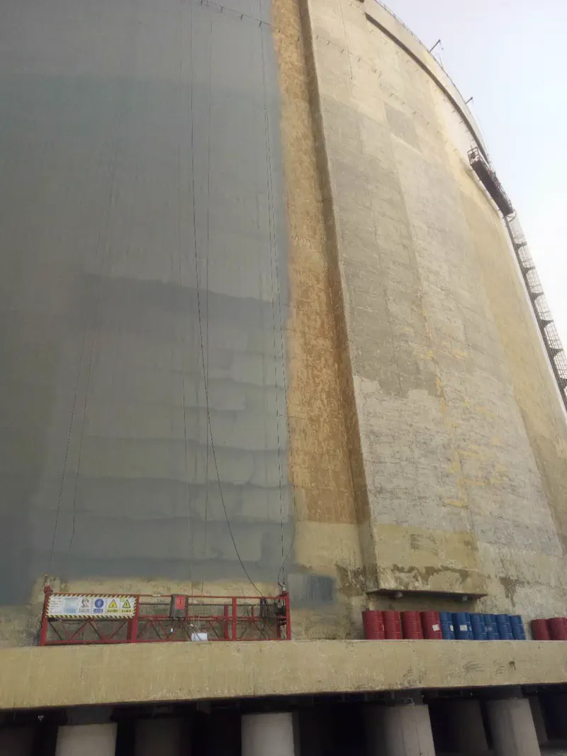Large white cylindrical tank — polyurea waterproofing project