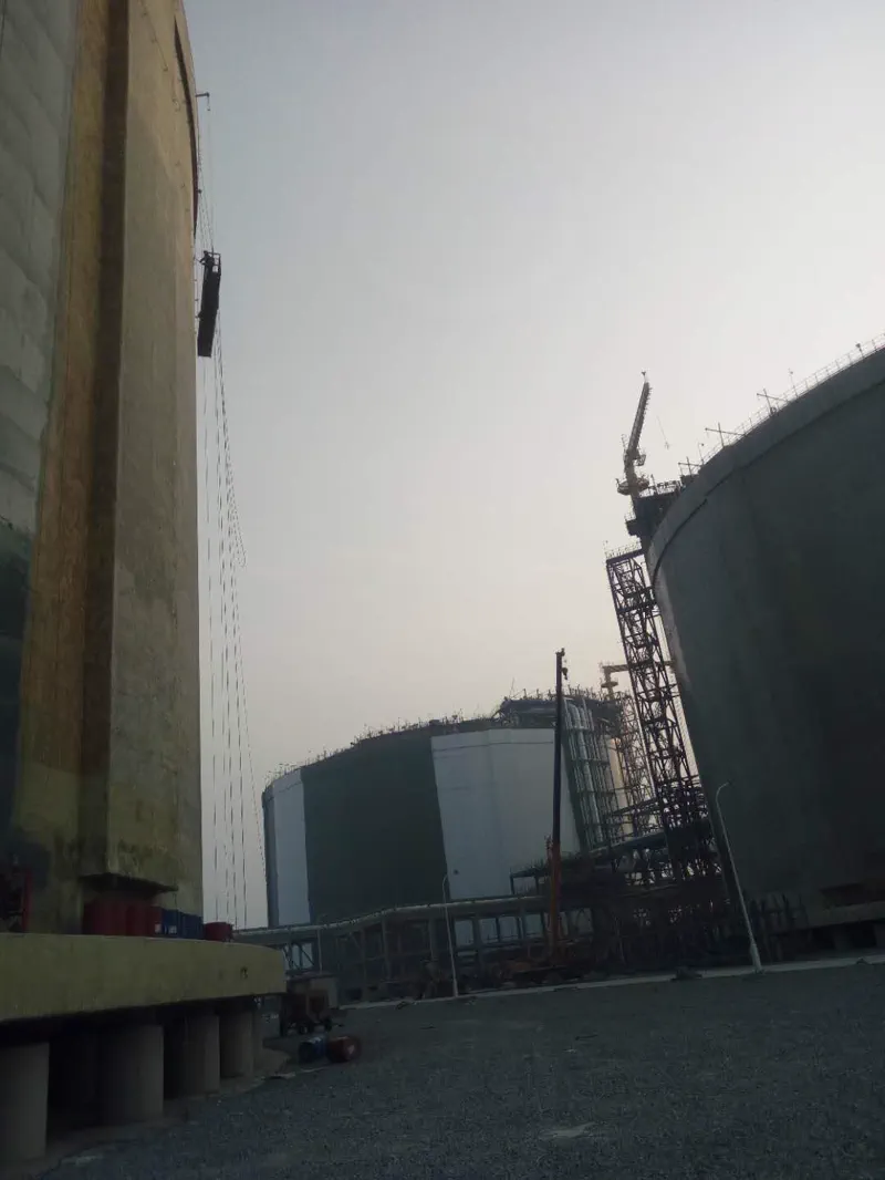 Large spherical/cylindrical tank exterior — bulk storage waterproofing